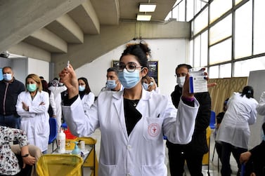 A  nurse holds a dose of the Russian Sputnik V vaccine in Tunisia's capital Tunis, at the start of the country's Covid-19 vaccination programme. AFP