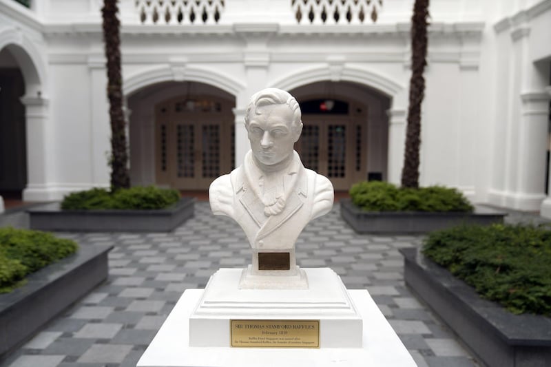A bust of Sir Thomas Stamford Raffles, the British founder of modern Singapore, stands at the Raffles Hotel. Bloomberg