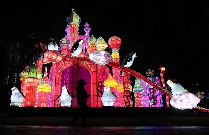 DUBAI, UNITED ARAB EMIRATES , October 14 – 2020 :- View of the colourful light figures at the Dubai Garden Glow season 6 which opened on 12th October at the Zabeel park in Dubai. No sitting allowed on the benches as a precautionary measure against the spread of coronavirus. Security at the entrance gate checks the body temperature of all the visitors. (Pawan Singh / The National) For Life Style/Online/Instagram/Big Picture. Story by Evelyn Lau