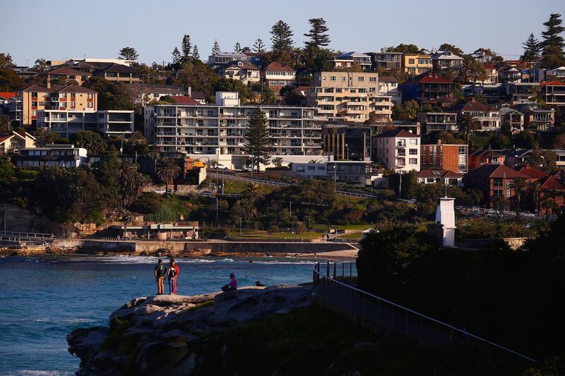 Residential buildings stand along the coastline near Bondi Beach in Sydney, Australia, on Wednesday, May 15, 2019. Australia's economy has been weighed down by a retrenchment in household spending as property prices slump and slash personal wealth. An election Saturday is likely to see the opposition Labor party win power and lift spending further. Photographer: David Gray/Bloomberg