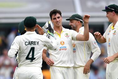 Australian Captain Pat Cummins (C) celebrates taking a wicket during day one of the first Ashes cricket Test match between England and Australia at the Gabba in Brisbane on December 8, 2021.  (Photo by Dan PELED  /  AFP)  /  -- IMAGE RESTRICTED TO EDITORIAL USE - STRICTLY NO COMMERCIAL USE --