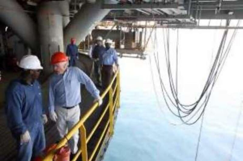 Republican presidential candidate, Sen. John McCain, R-Ariz., second from left, tours the Chevron Genesis Oil Rig Platform with Joe St. Ann, left,  Offshore Installation Manager,  in the Gulf of Mexico near New Orleans, La., Tuesday, Aug. 19, 2008.   (AP Photo/Mary Altaffer)