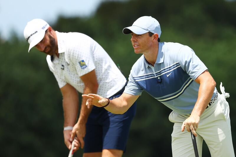Dustin Johnson  and Rory McIlroy. AFP