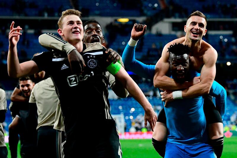 Ajax players celebrate. AFP