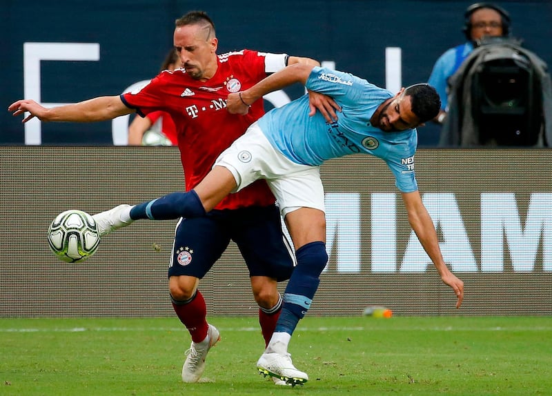Bayern Munich's Franck Ribery fights for the ball with Manchester City's Riyad Mahrez. AFP