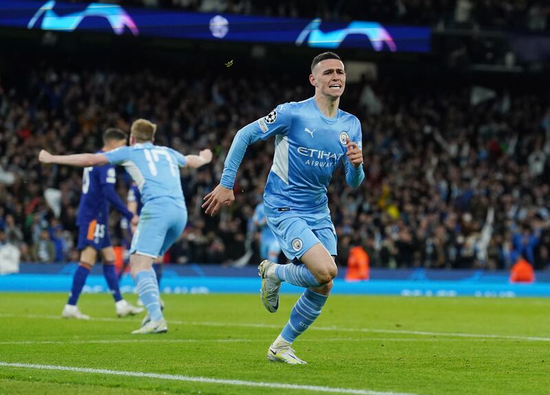 Phil Foden celebrates scoring City's third goal. PA