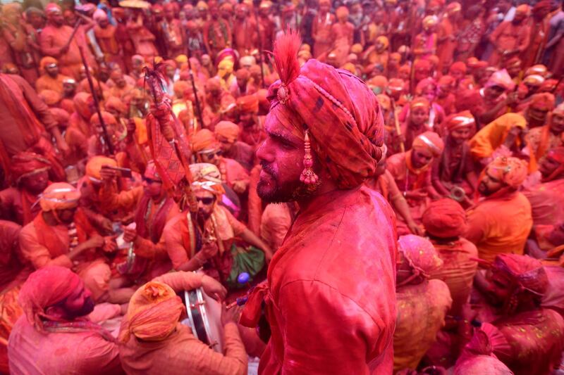 Hindu devotees celebrate Holi, the spring festival of colours, during a traditional gathering at a temple in Nandgaon village in Uttar Pradesh state on March 5, 2020. AFP