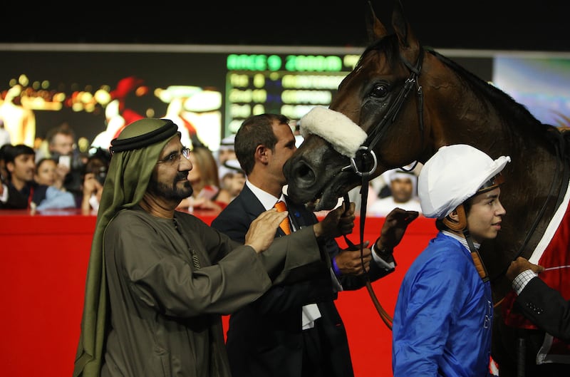 DUBAI , UNITED ARAB EMIRATES Ð Mar 31 :  Sheikh Mohammed Bin Rashid Al Maktoum , Vice President and Prime Minister of UAE with Monterosso ( GB ) ridden by Mickael Barzalona ( right ) after winning the Dubai World Cup ( 2000m All Weather ) worlds richest horse race at Meydan Racecourse in Dubai. The trainer is Mahmoud Al Zarooni. ( Pawan Singh / The National ) For Sports. Story by Sarah 
