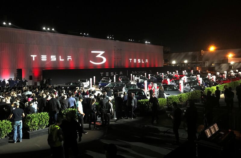 FILE PHOTO - Tesla introduces Model 3 cars off the Fremont factory's production line during an event at the company's facilities in Fremont, California, U.S. on July 28, 2017. REUTERS/Alexandria Sage/File Photo