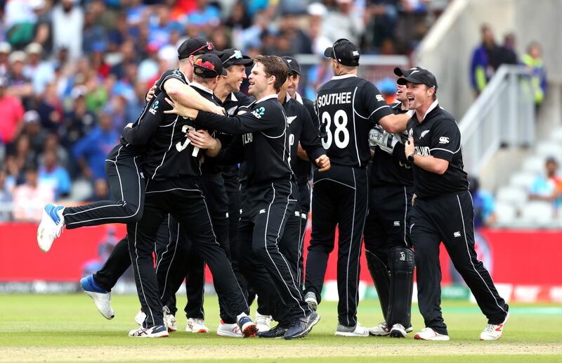 New Zealand players celebrate after India's MS Dhoni by Martin Guptill's direct hit. PA Photo