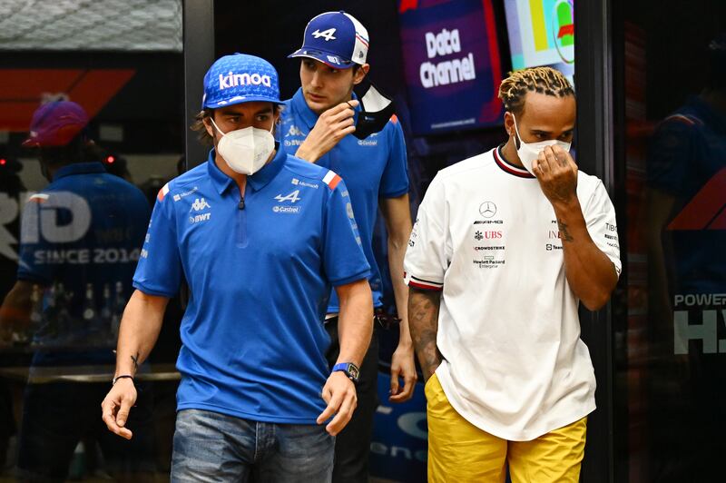 Lewis Hamilton, Fernando Alonso and Esteban Ocon after a meeting on Friday. Getty