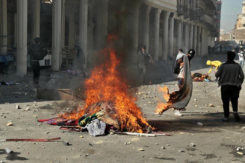 Protesters set fires during clashes between security forces and anti-government protesters. AP Photo