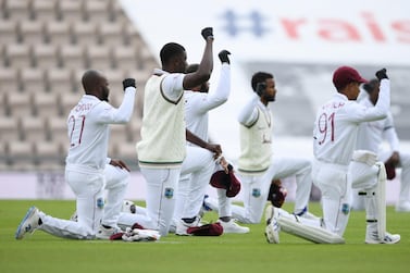 Cricket - First Test - England v West Indies - Rose Bowl Cricket Stadium, Southampton, Britain - July 8, 2020 West Indies players kneel in support of the Black Lives Matter campaign before the match , as play resumes behind closed doors following the outbreak of the coronavirus disease (COVID-19) Mike Hewitt/Pool via REUTERS