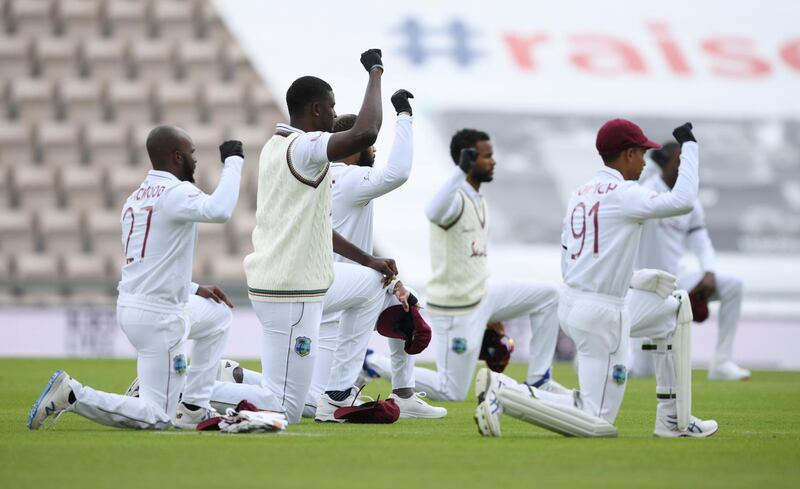 Cricket - First Test - England v West Indies - Rose Bowl Cricket Stadium, Southampton, Britain - July 8, 2020   West Indies players kneel in support of the Black Lives Matter campaign before the match , as play resumes behind closed doors following the outbreak of the coronavirus disease (COVID-19)   Mike Hewitt/Pool via REUTERS
