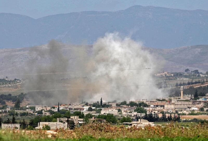 Smoke billows above buildings during shelling by government and allied forces, in the town of Hbeit in the southern countryside of the rebel-held Idlib province. AFP