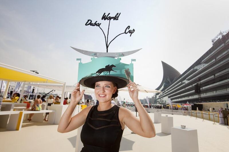 A race goer shows off her hat at last year's Dubai World Cup. Jaime Puebla / The National