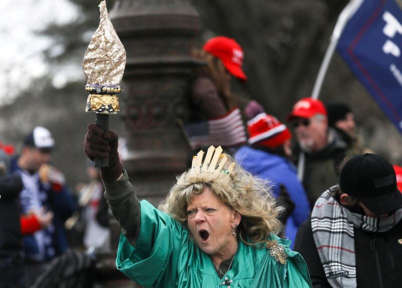 Leigh Ann Luck dressed up as Statue of Liberty shouts as supporters of U.S. President Donald Trump gather near U.S. Capitol building in Washington, U.S., January 6, 2021. REUTERS/Leah Millis TPX IMAGES OF THE DAY