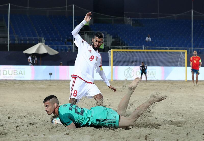 Dubai, United Arab Emirates - November 05, 2019: The UAE's Ali Mohammad and Spain's Pablo Lopez Molina battle during the game between the UAE and Spain during the Intercontinental Beach Soccer Cup. Tuesday the 5th of November 2019. Kite Beach, Dubai. Chris Whiteoak / The National