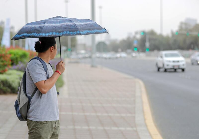 Abu Dhabi, United Arab Emirates, March 24, , 2019.  -- Sudden downpour at the Al Mushrif area Abu Dhabi. --  A commuter waits for the bus to arrive.
Victor Besa/The National
Section:  
Reporter: