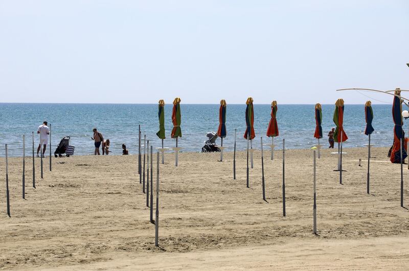 People enjoy the beach during a period of gradual relaxation of lockdown restrictions in Larnaca, Cyprus. EPA