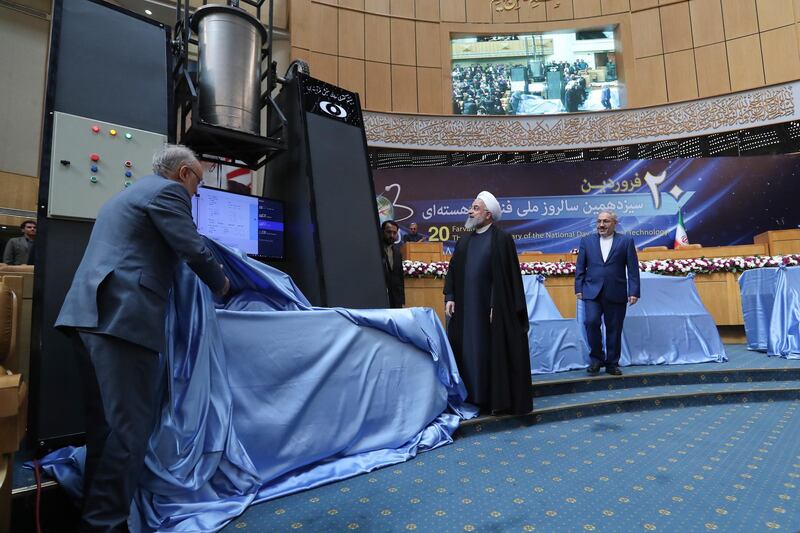 epa07493117 A handout photo made available by the presidential office shows Iranian president Hassan Rouhani (C) and head of Iran's nuclear technology organisation Ali Akbar Salehi (L) unveiling nuclear technology achievements during the National Nuclear Technology Day in Tehran, Iran, 09 April 2019. According to media reports, Iran unveiled its 114 nuclear achievements as president Rouhani condemned the US following a statement by US President Donald J. Trump designating Iran's elite Revolutionary Guard Corps as a foreign terrorist organization.  EPA/PRESIDENTIAL OFFICE HANDOUT  HANDOUT EDITORIAL USE ONLY/NO SALES