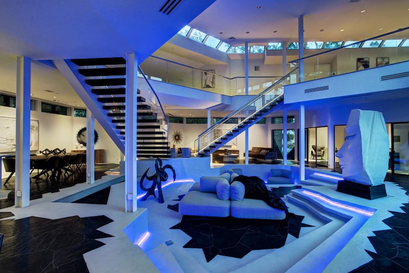 Blue strip lighting gives the sunken living area an otherworldly feel. Courtesy Martha Turner Sotheby's International Realty