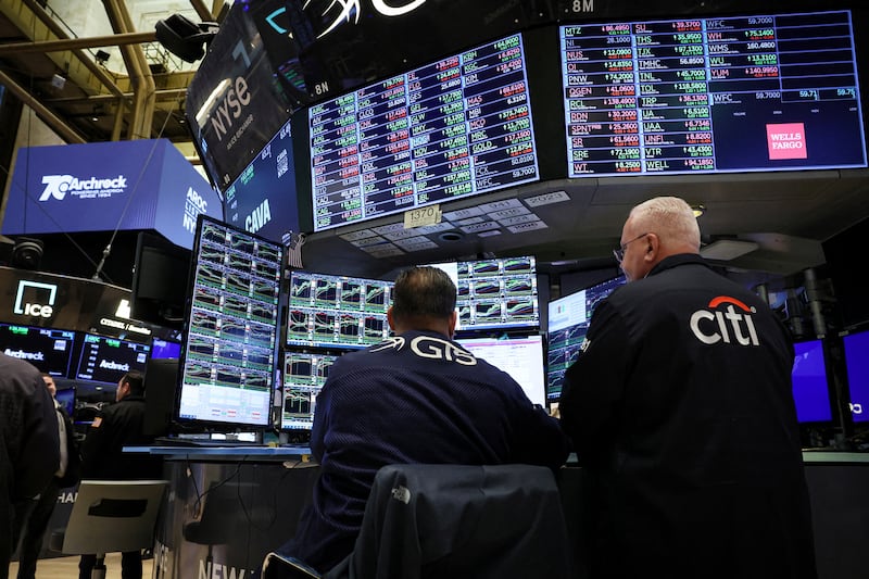 Traders work at the New York Stock Exchange. The S&P 500 and Nasdaq registered their biggest weekly percentage gains since early November 2023. Reuters