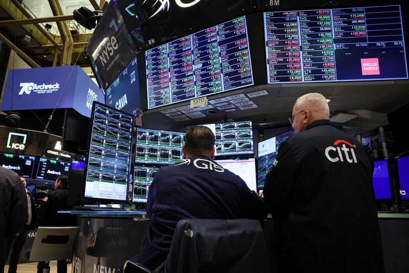 Traders work at the New York Stock Exchange. The S&P 500 and Nasdaq registered their biggest weekly percentage gains since early November 2023. Reuters