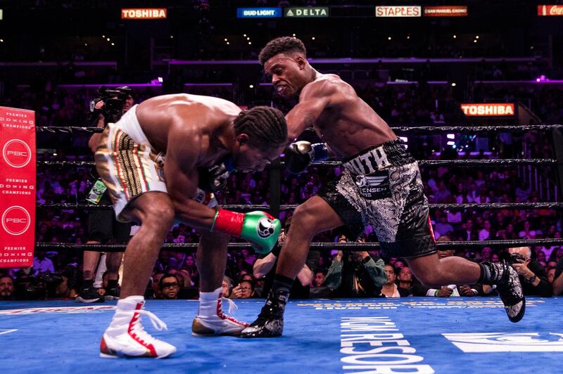 Errol Spence Jr lands a shot on Shawn Porter during their fight at the Staples Center. EPA