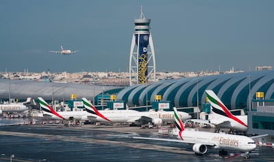 FILE - In this Dec. 11, 2019 file photo, an Emirates jetliner comes in for landing at Dubai International Airport in Dubai, United Arab Emirates. The airport is getting busier but itâ€™s a long way from what it once was amid the coronavirus pandemic. To boost those numbers, airport CEO Paul Griffiths is urging countries to move away from mandatory quarantines on arriving passengers and toward the strategy embraced by Dubai. That includes aggressive coronavirus testing before departure, followed by mandatory mask-wearing on aircraft. (AP Photo/Jon Gambrell, File)