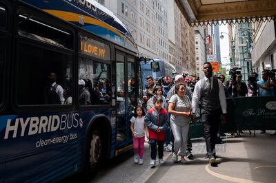 A family of asylum seekers arrive at the Roosevelt Hotel. Reuters