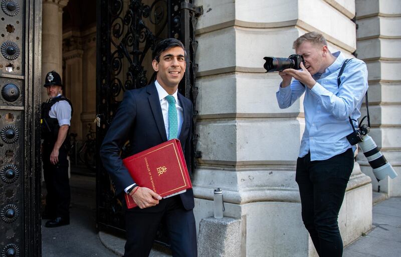 Rishi Sunak, U.K. chancellor of the exchequer, walks in Downing Street in London, U.K., on Friday, May 29, 2020. Sunak is expected to pass some of the burden of supporting furloughed workers onto their employers from August. Photographer: Chris J. Ratcliffe/Bloomberg