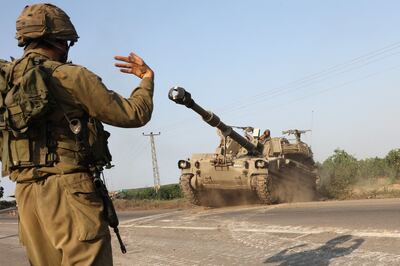 An Israeli soldier directs a self-propelled howitzer near the southern city of Ashkelon, on Sunday, a day after Hamas launched a major attack. AFP