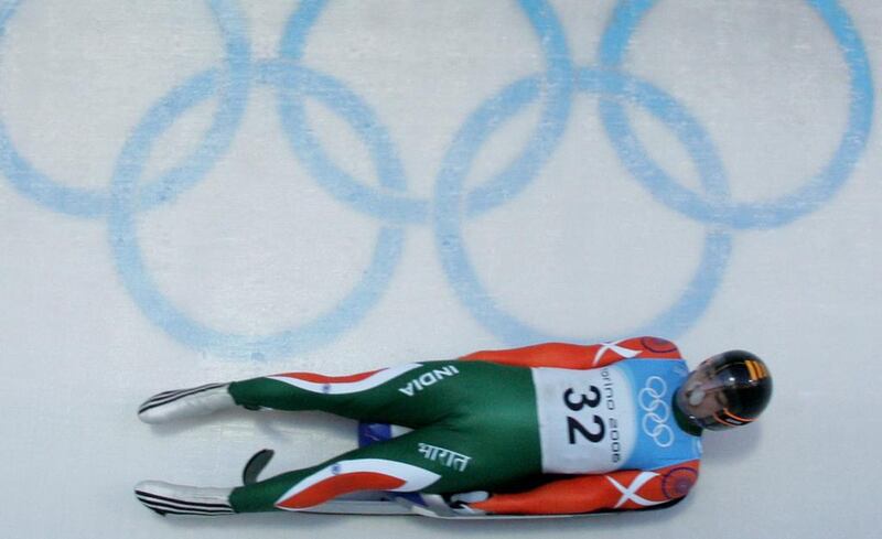 India's Shiva Keshavan speeds down the luge track during a training run at the Turin 2006 Olympic Winter Games. Keshavan is clear to compete at next year's Winter Games in Sochi after the IOC lifted India's ban. Johannes Simon / AFP
