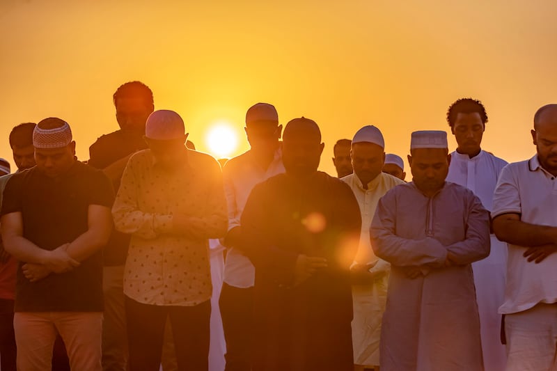 Muslims pray in Dubai's Al Barsha district on the first day of Eid Al Fitr. Chris Whiteoak / The National