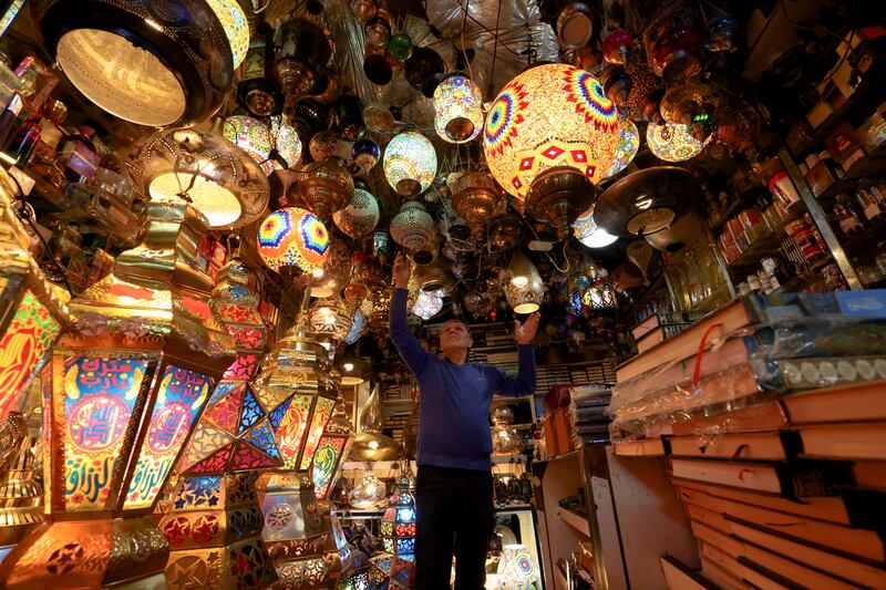 A trader arranges decorative lanterns in Jerusalem's Old City. Reuters