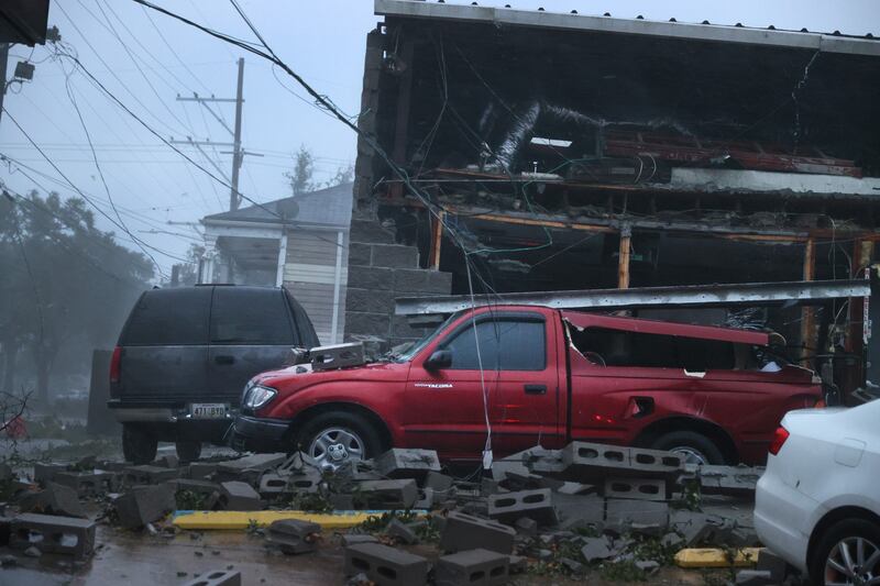 A building collapsed and damaged vehicles during Hurricane Ida in New Orleans, Louisiana. AFP