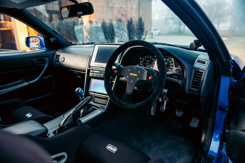 The conversion work included the installation of a custom roll cage, a bespoke dashboard-mounted monitor and custom racing bucket seats