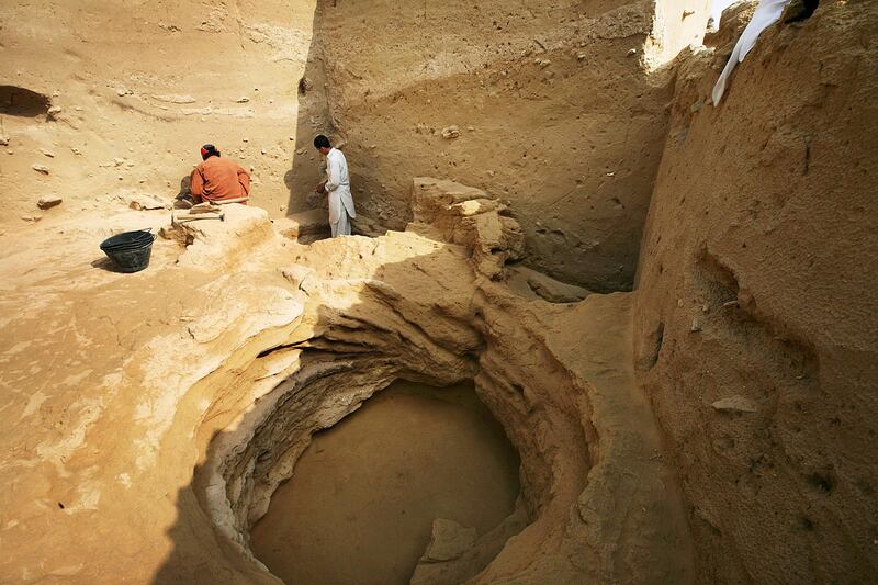 Sharjah, United Arab Emirates --- January 5, 2010 --- Archaeologists and workers clear bedrock at the Muwaileh Archaeological site in Sharjah. According to archaeologist Peter Magee, underneath the site is water but a critical issue is how accessible is the ground water. ( Delores Johnson / The National ) *** Local Caption ***  dj_05jan10_na_archaeological_009.jpg