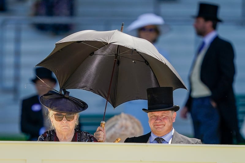 Race-goers waiting for the royal procession. Getty Images