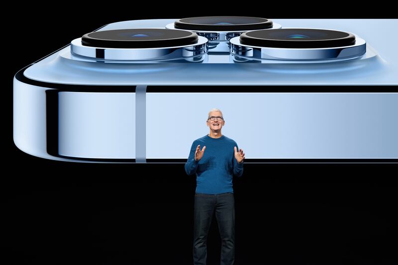 Apple CEO Tim Cook showcasing the advanced camera system on the new iPhone 13 Pro. Courtesy Apple