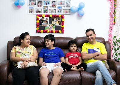 DUBAI, UNITED ARAB EMIRATES. 29 JULY 2020. 
Nagendra Gaur with his wife Reena, and sons Mudit and Rughuveer.

Dubai resident Nagendra has tested three times over the past month so he can cross the border to supervise project sites in Abu Dhabi.
(Photo: Reem Mohammed/The National)

Reporter:
Section: