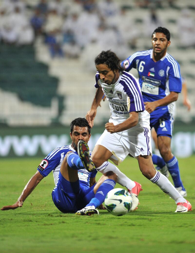 Al Nasr (Blue) matches up against Al Ain (White) at Al Maktoum Stadium on Tuesday November 13, 2012. (Al Ittihad)