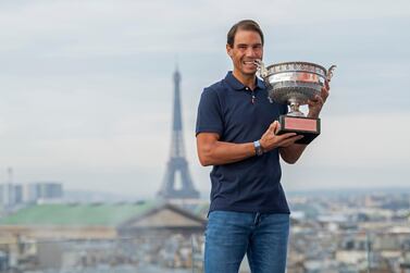 PARIS, FRANCE - OCTOBER 12: Rafael Nadal of Spain poses on the roof of Les Galeries Lafayette with Les Mousquetaires trophy following his victory in the Men's Singles Finals against Novak Djokovic of Serbia on day fifteen of the 2020 French Open on October 12, 2020 in Paris, France. Rafael Nadal won his 13th trophy. (Photo by Aurelien Meunier/Getty Images)