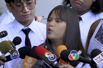 In this image made from video, a student leader Sugreeya Wannayuwat, center, who led a legal challenge against the emergency decree representing a group of university students, speaks to journalists outside the Civil Court in Bangkok, Thailand, Thursday, Oct. 22, 2020. Thailandâ€™s government has canceled a state of emergency it had declared last week for Bangkok in a gesture offered by the embattled prime minister to cool massive student-led protests seeking democracy reforms. The decree had banned public gatherings of more than four people and allowed censorship of the media, among other provisions. It was challenged in court by an opposition party and a group of university students. (AP Photo)