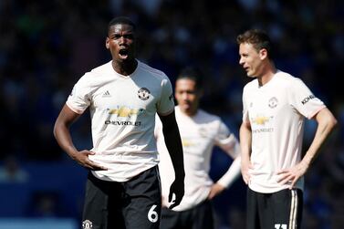 Manchester United's Paul Pogba, left, looks dejected after Sunday's 4-0 defeat to Everton at Goodison Park. Reuters