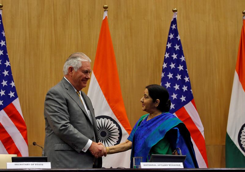 U.S. Secretary of State Rex Tillerson and India's Foreign Minister Sushma Swaraj shake their hands after attending a media briefing in New Delhi, India, October 25, 2017. REUTERS/Altaf Hussain