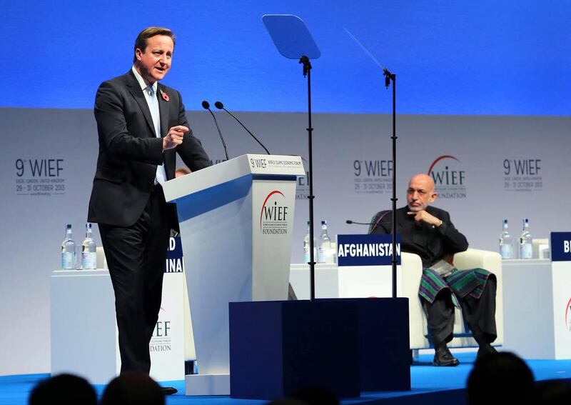 The British prime minister David Cameron gives a speech while Afghan president Hamid Karzai listens during the opening day of the World Islamic Economic Forum. Stephen Lock for The National