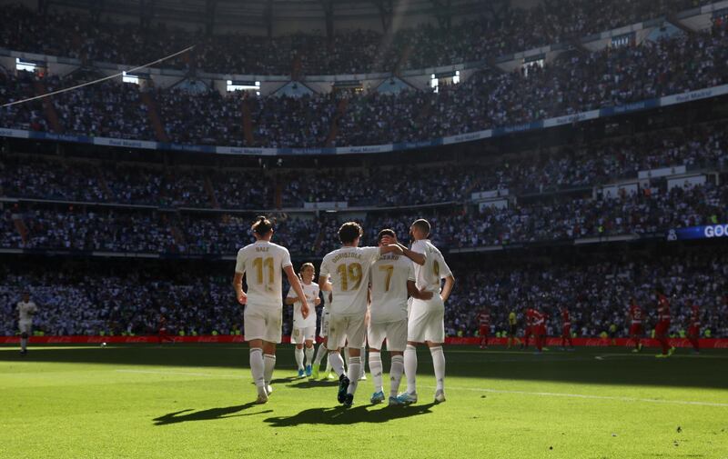 Real Madrid's Eden Hazard celebrates with team mates scoring their second goal. Reuters