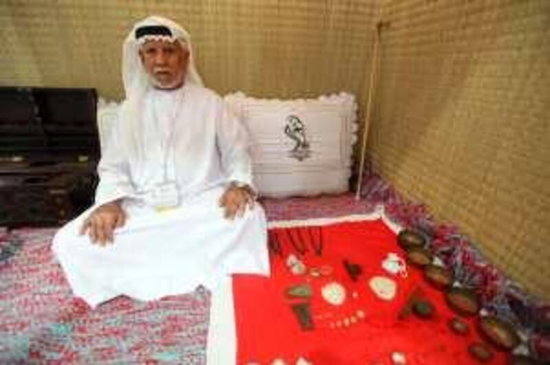 March 3, 2010 / Abu Dhabi / Khamis al Rumaithy, 86, a former weatherman and sailor has booth at the Abu Dhabi International Book Fair's heritage center showcasing pearls and a few tools relating to pearl diving March 10, 2010.  (Sammy Dallal / The National)

